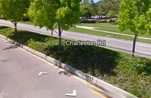 White arrows overlaid on Street View